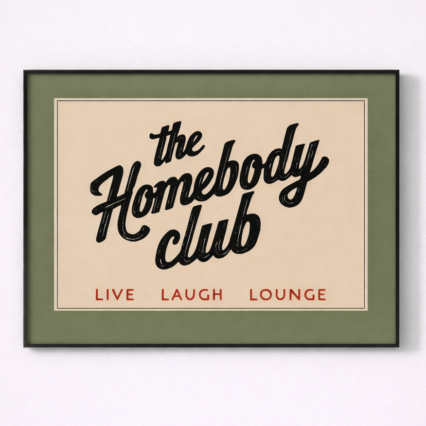 Framed print with 'the Homebody Club' text on a beige background