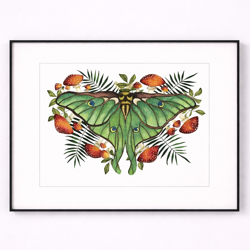 Framed artwork of a green moth with flowers and leaves on a white background
