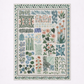 Decorative rug with a pattern of various plants and flowers on a white background