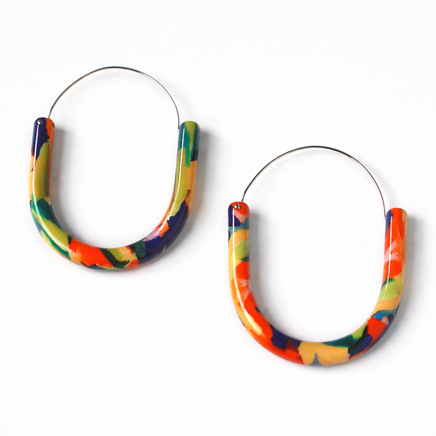 Colorful hoop earrings on a white background