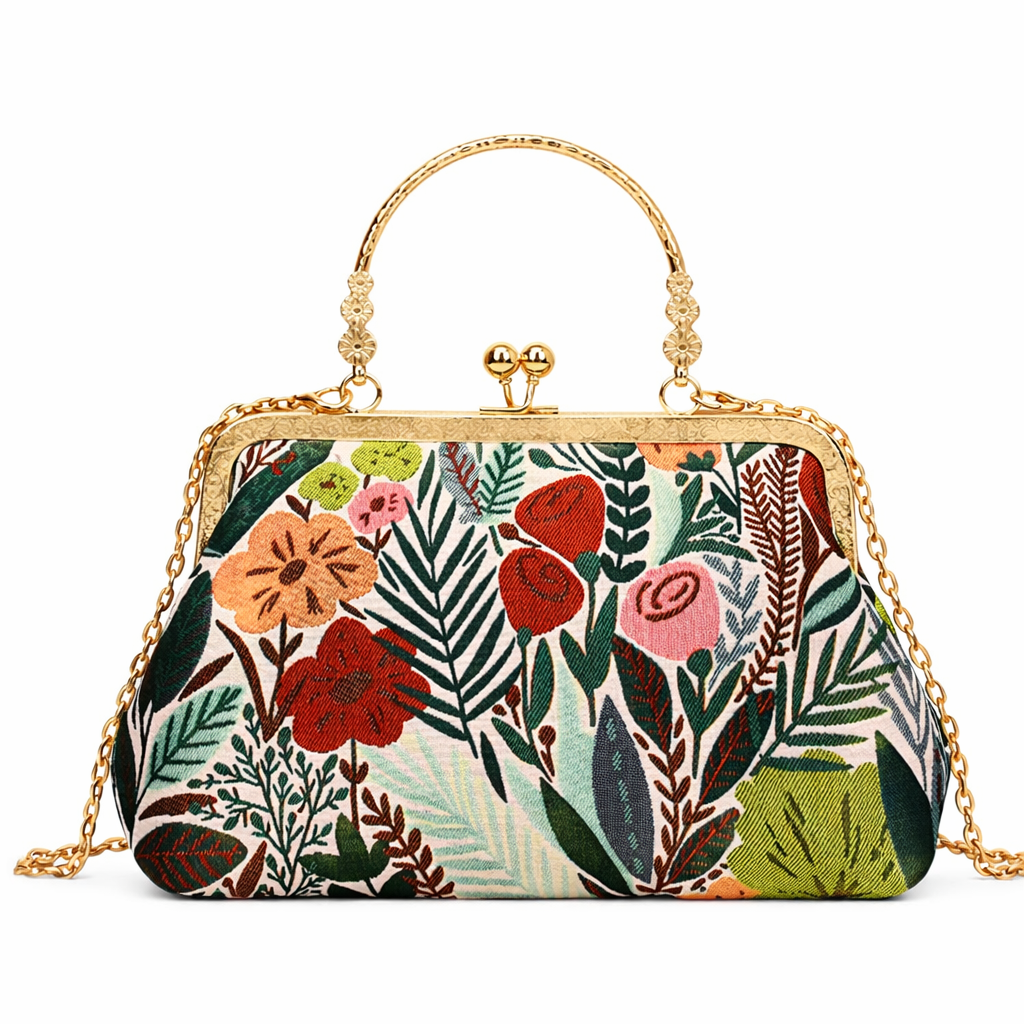 Floral patterned handbag with gold chain and handle on a white background