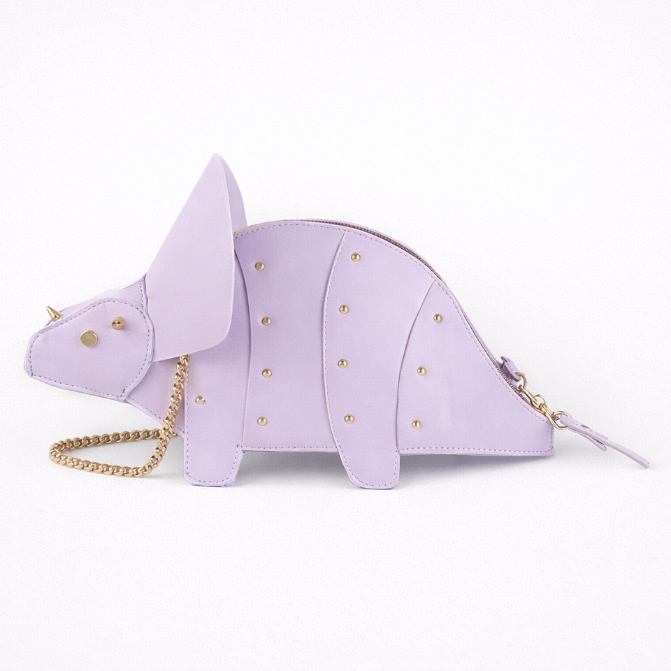 Lavender dinosaur-shaped handbag with gold chain on a white background