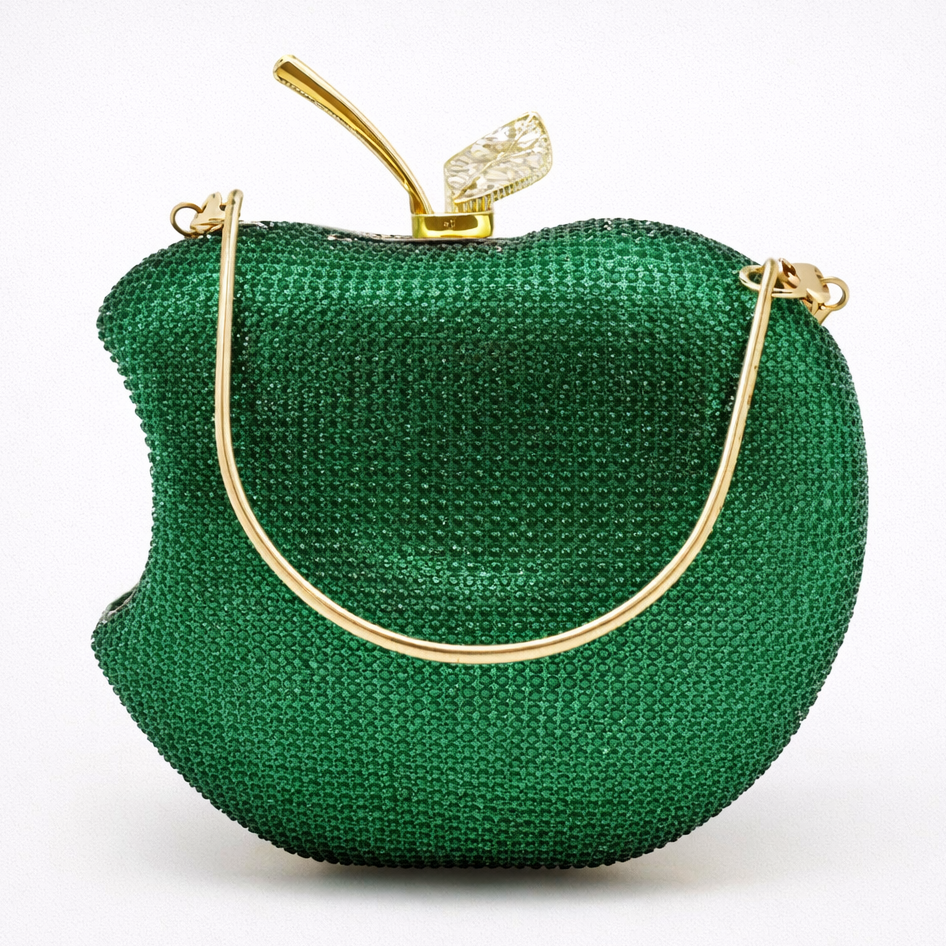 Green apple-shaped handbag with gold accents on a white background