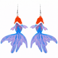 Pair of fish tail earrings with orange tops and blue tails on a white background