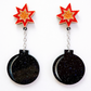 Star-shaped earrings with black round components on a white background