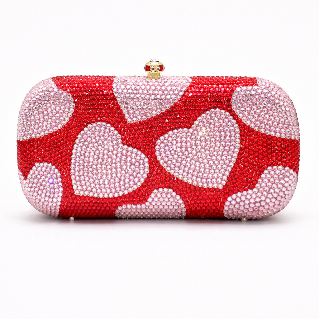 Red clutch bag with white heart patterns on a white background