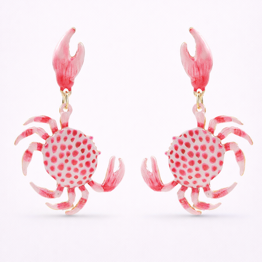 Pair of pink crab-shaped earrings on a white background