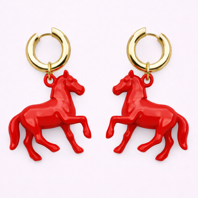 Red horse-shaped earrings with gold hoop backs on a white background