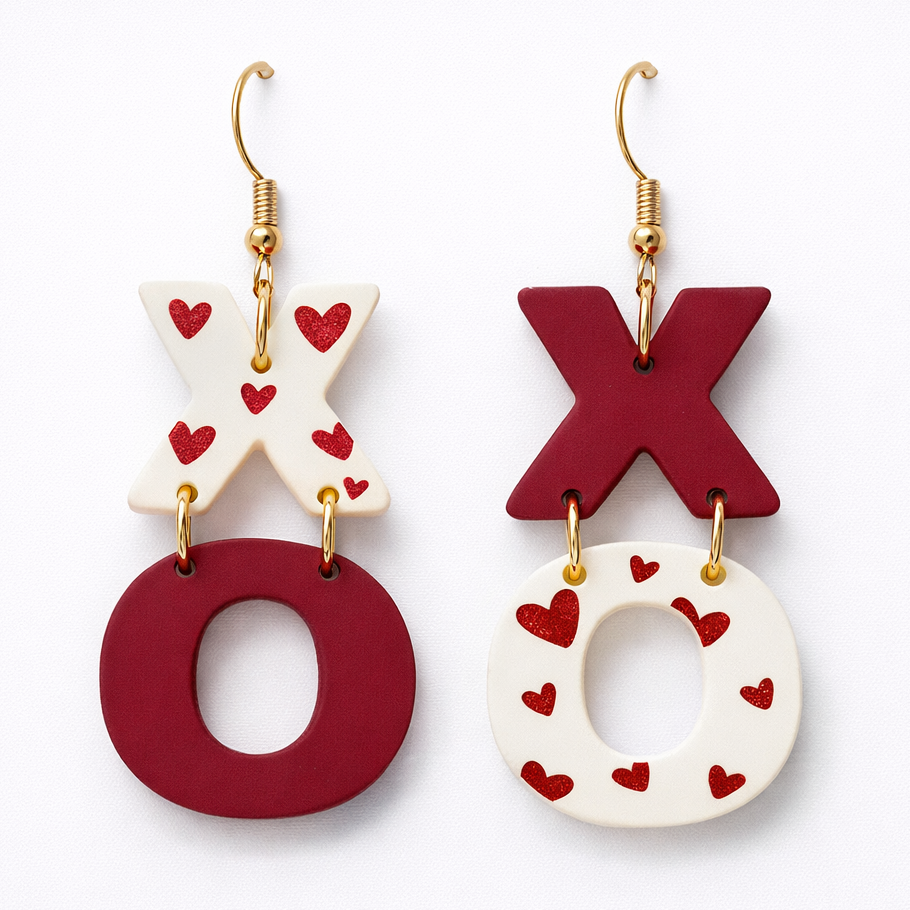 Pair of earrings with 'XO' design on a white background