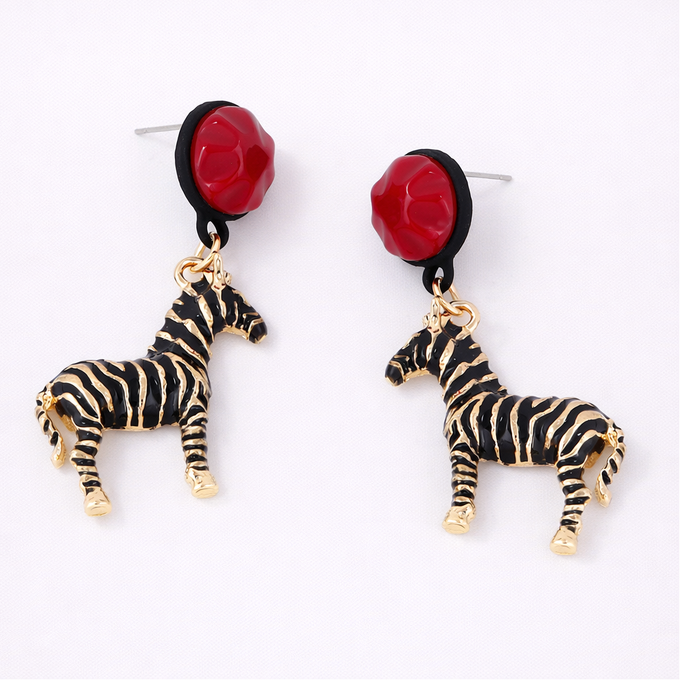 Zebra earrings with red rose-like pendants on a white background