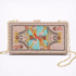 Decorative clutch bag with beaded design on a white background