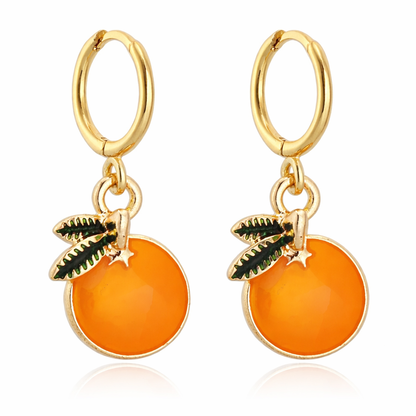 Gold hoop earrings with orange fruit charms on a white background