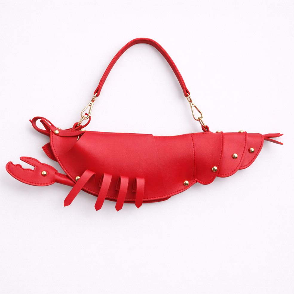 Red lobster-shaped handbag on a white background