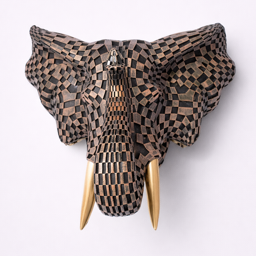 Decorative elephant head with checkered pattern and gold tusks on a white background