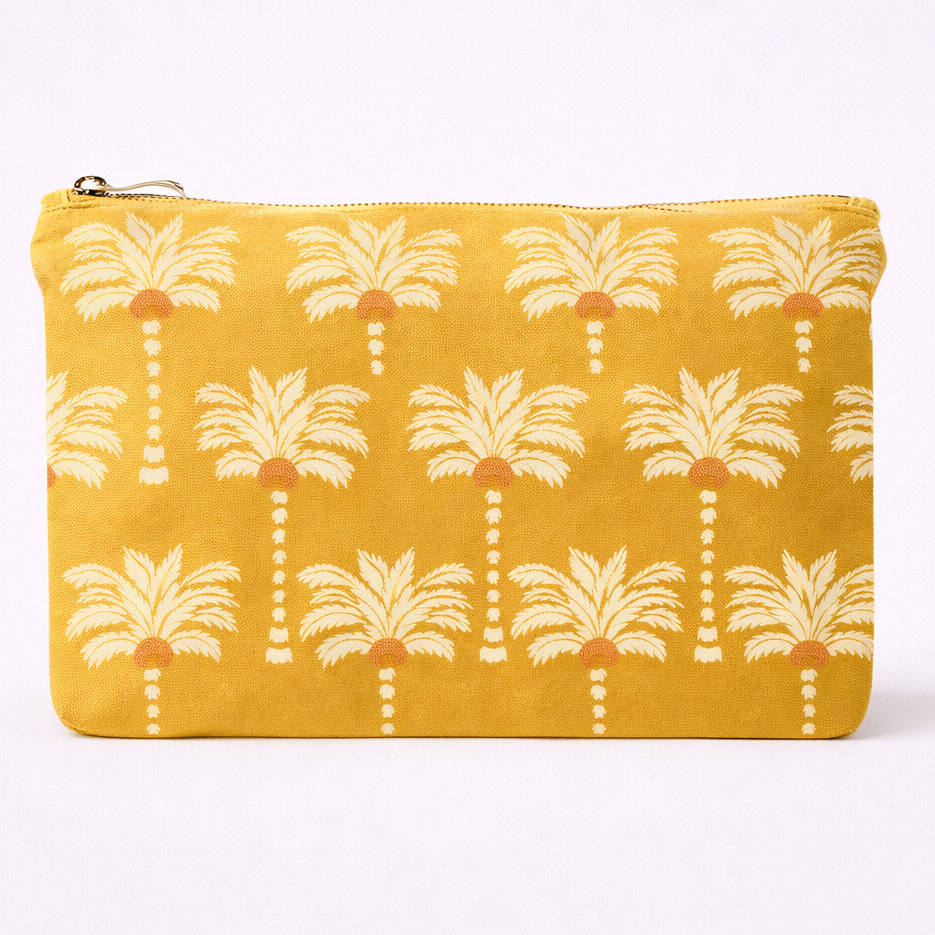 Yellow pouch with palm tree pattern on a white background