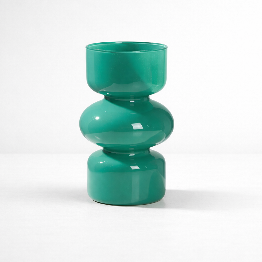 Green vase with a modern design on a white background