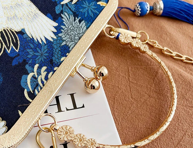 Gold bracelet with decorative elements on a blue floral background