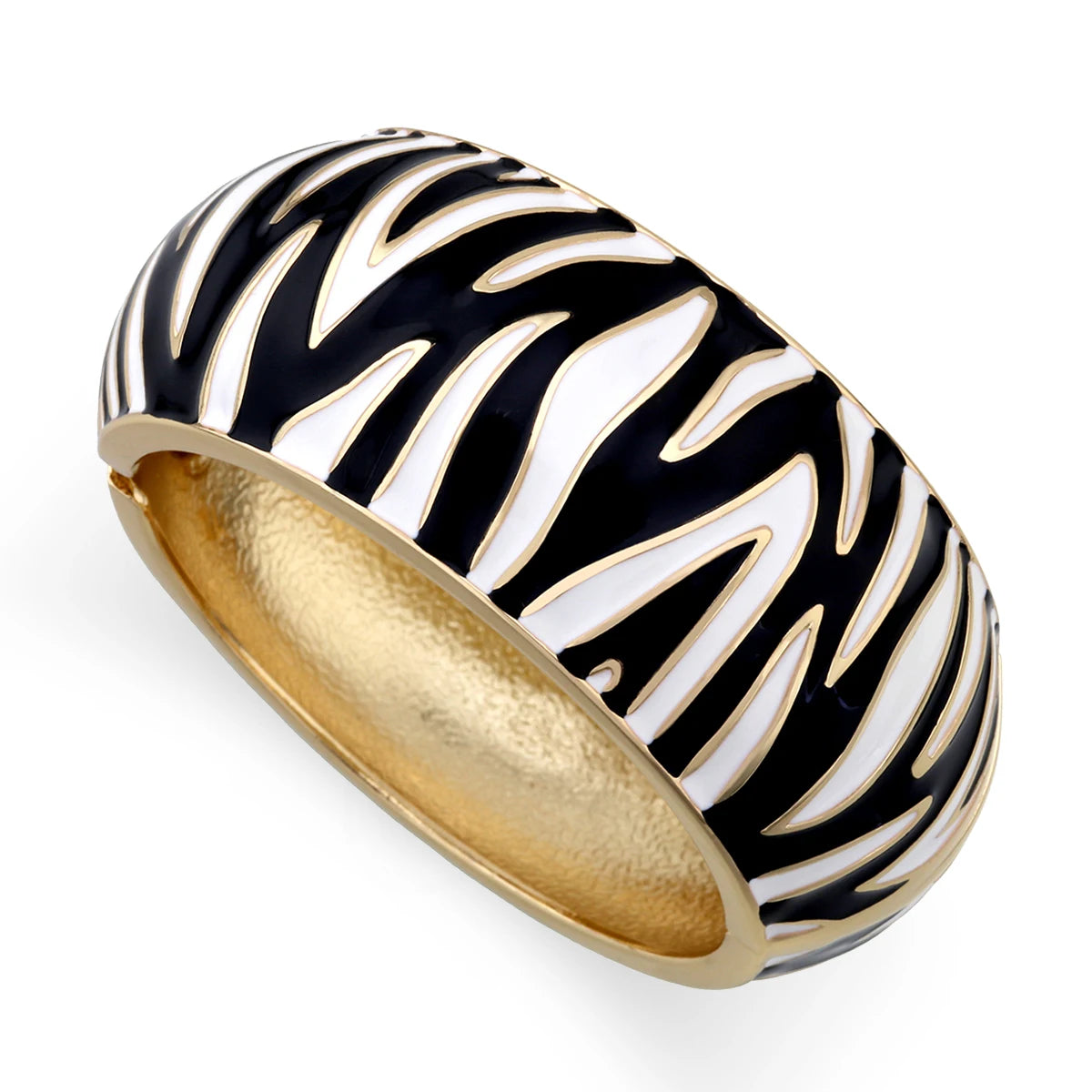 Gold and black zebra-patterned ring on a white background