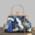 Embroidered handbag with crane design on a wooden surface