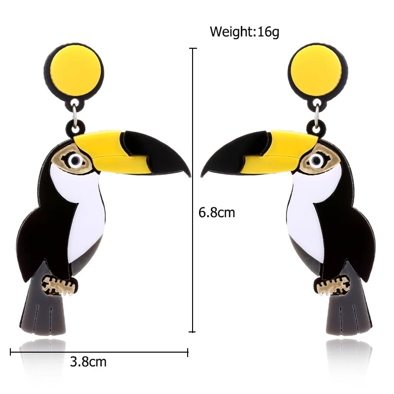 Toucan-shaped earrings with measurements on a white background