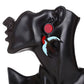 Earrings with red and blue design on a black mannequin ear