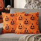 Orange pillows with black jack-o'-lantern faces on a gray couch, Halloween-themed decor.