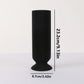 Black ribbed vase with measurements on a white background