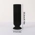 Black ribbed vase with measurements on a white background