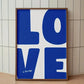 Framed artwork with 'LOVE is the key' text on a white background
