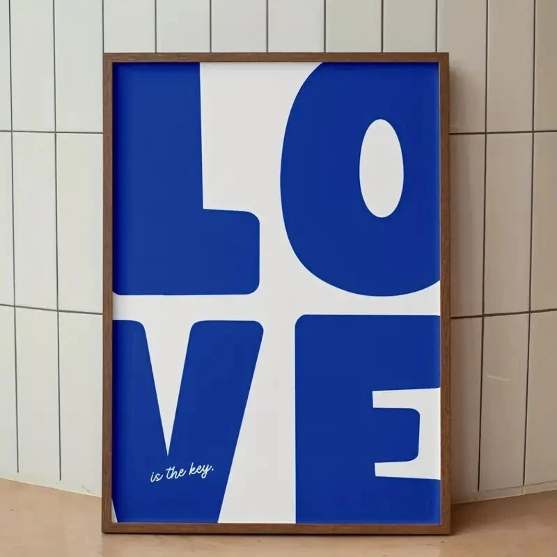 Framed artwork with 'LOVE is the key' text on a white background
