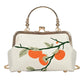 Handbag with orange and green design on a white background