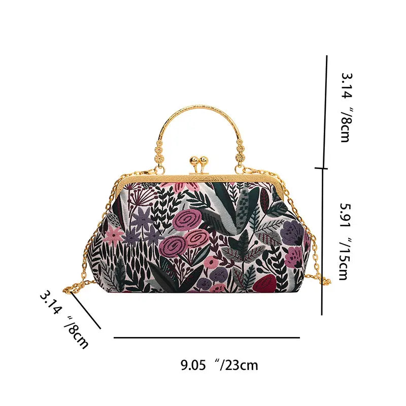 Floral patterned handbag with gold accents and dimensions on a white background