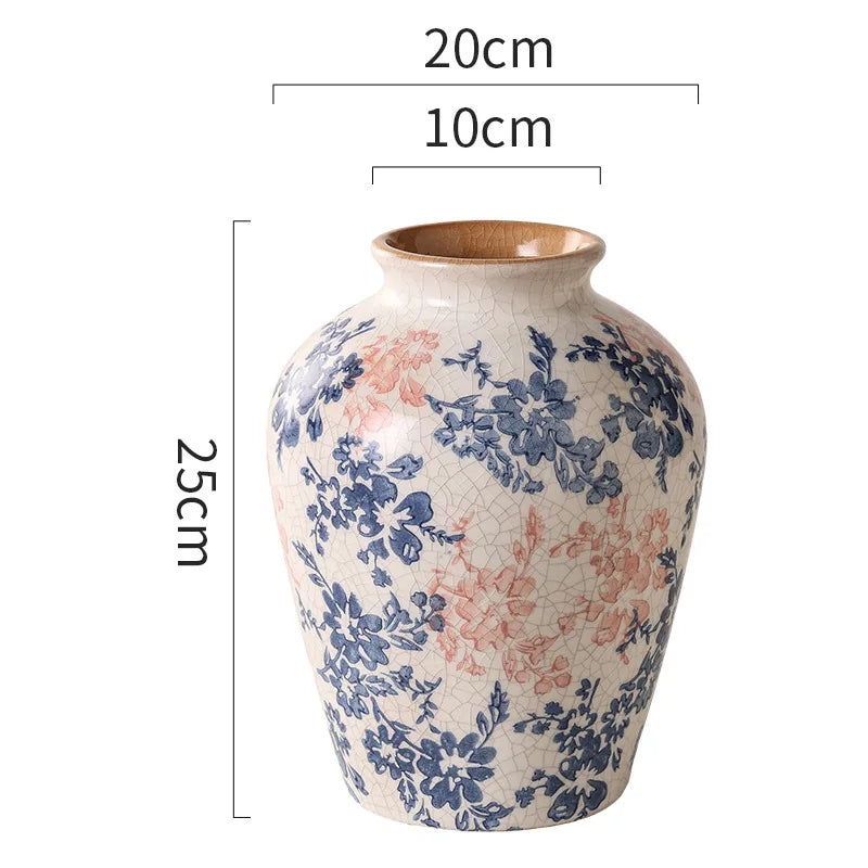 Ceramic vase with floral patterns and measurements on a white background