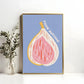 Framed artwork of a fig with 'Figgin' Awesome' text on a blue background, next to a vase with greenery.