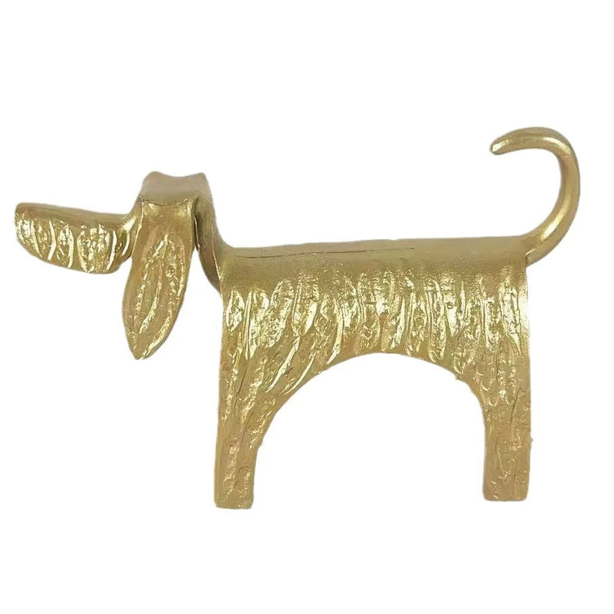 Gold dog-shaped object on a white background