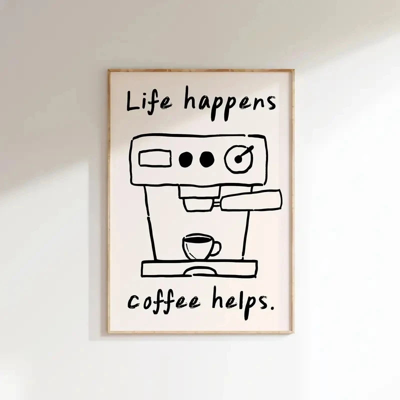 Framed artwork with a coffee machine illustration and 'Life happens, coffee helps.' text on a white wall.