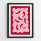 Framed artwork with red peppers and 'You're Hot' text on a red background