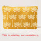 Yellow pouch with palm tree pattern on a white background
