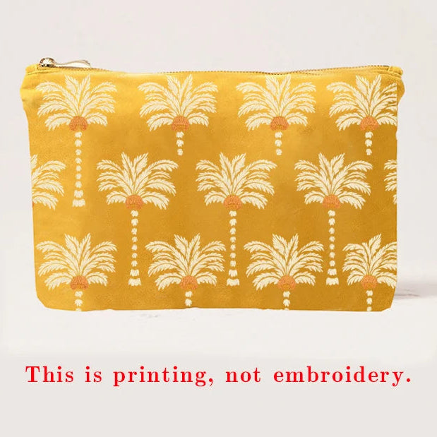Yellow pouch with palm tree pattern on a white background
