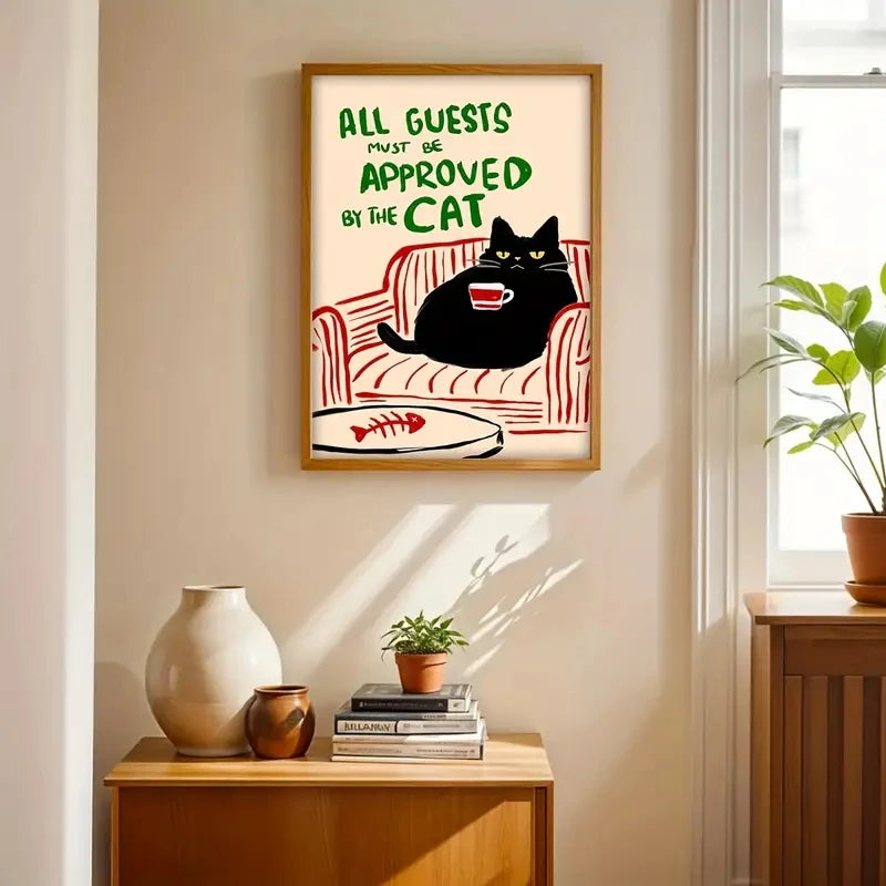 Framed artwork with a cat on a couch and text in a home setting