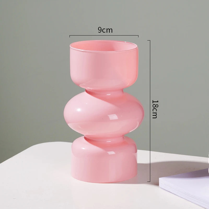 Pink vase with measurements on a gray background
