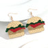 Burger-shaped earrings on a white background
