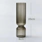 Smoky glass vase with dimensions on a light gray background
