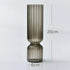 Smoky glass vase with dimensions on a light gray background