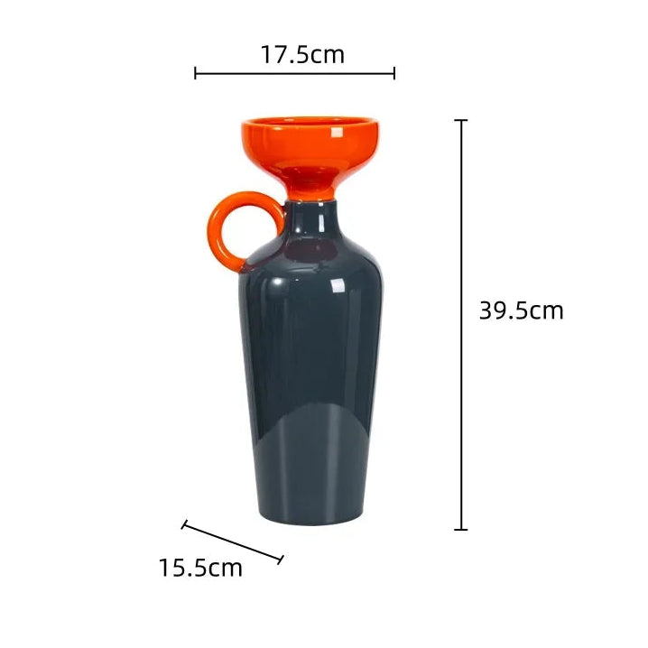 Gray carafe with orange funnel and handle on a white background