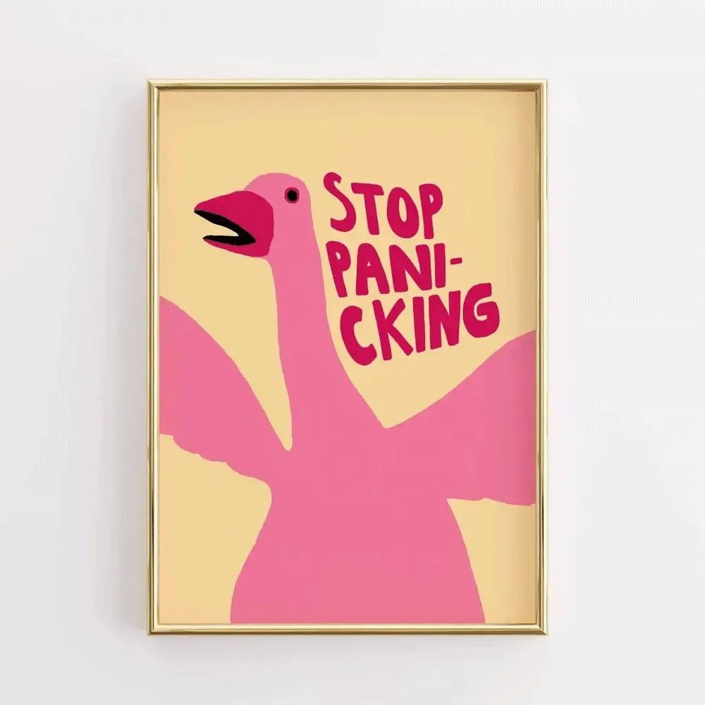 Framed artwork with a pink flamingo silhouette and 'Stop Panicking' text on a beige background.