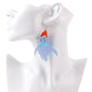 Earrings with colorful fish design on a white mannequin ear.