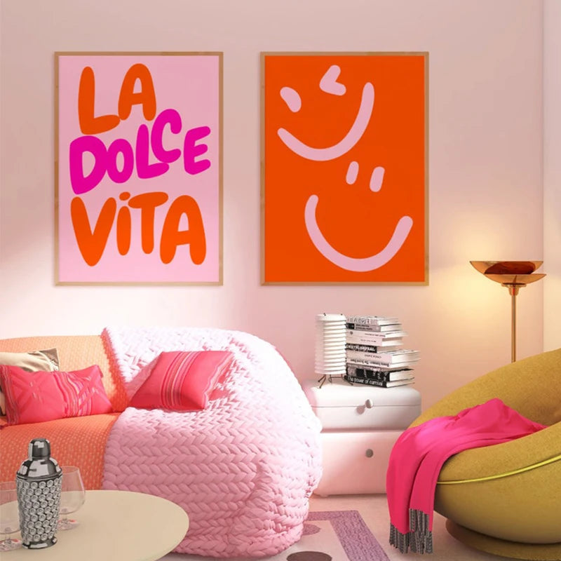 Modern bedroom with pink and orange wall art, a bed, and a green chair.