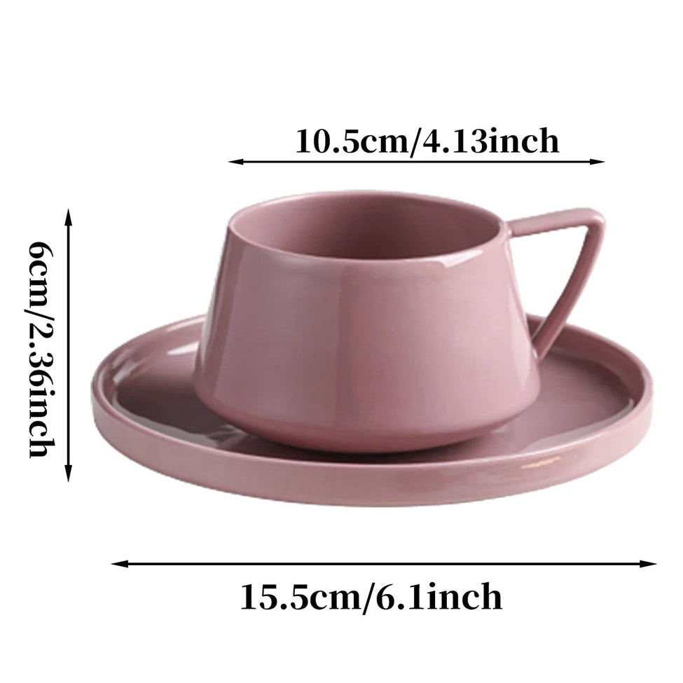 Pink ceramic cup and saucer with dimensions labeled on a white background