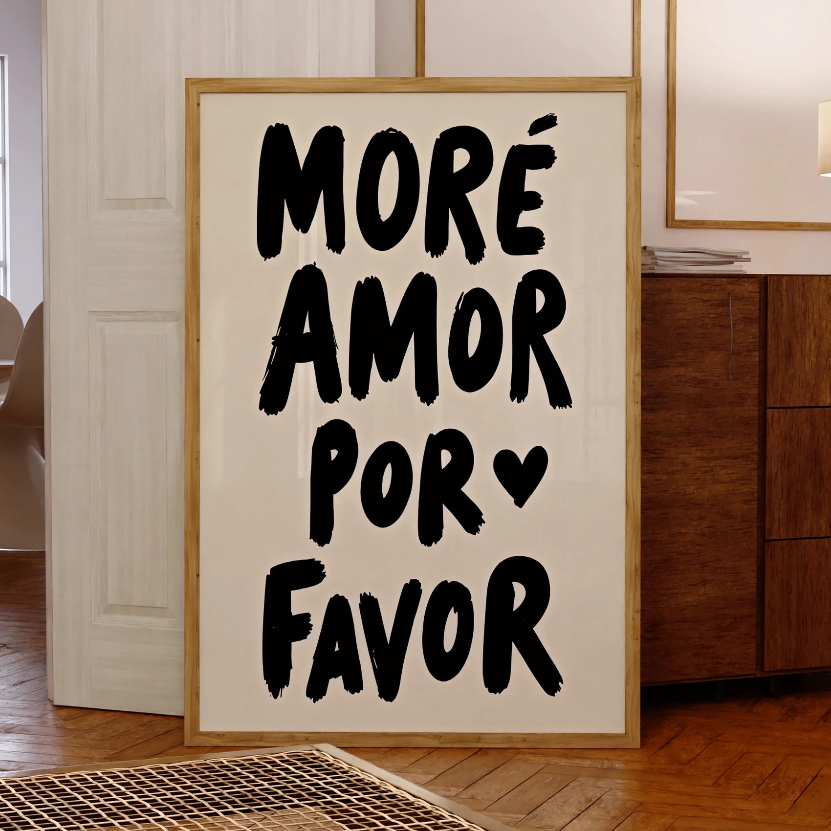 Framed artwork with 'Moreámor por ❤️ Favor' text in a room.